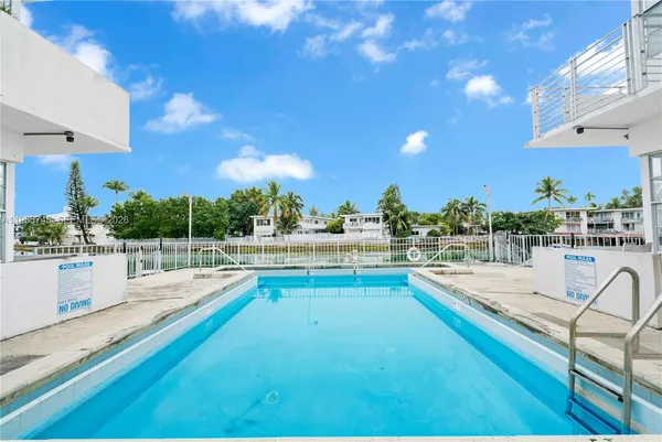 a view of a swimming pool with seating area