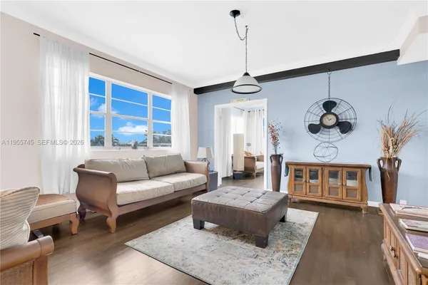 a living room with furniture and a window