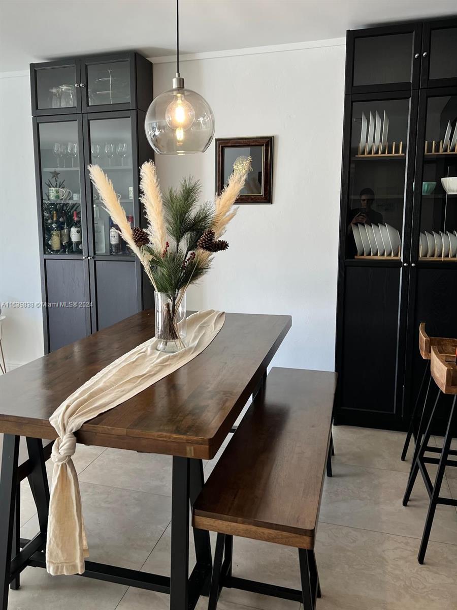 600 Northeast 36th Street, Unit 204 Miami, FL 33137 - Photo 16 of 31 a dining room with furniture and wooden floor