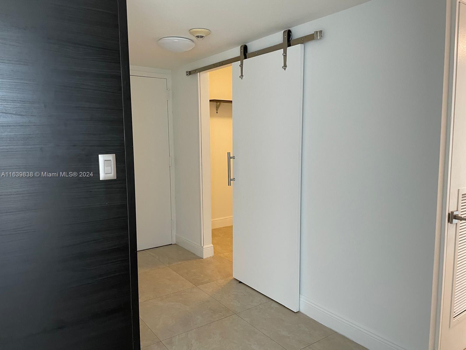 600 Northeast 36th Street, Unit 204 Miami, FL 33137 - Photo 19 of 31 a bathroom with a shower and a glass door