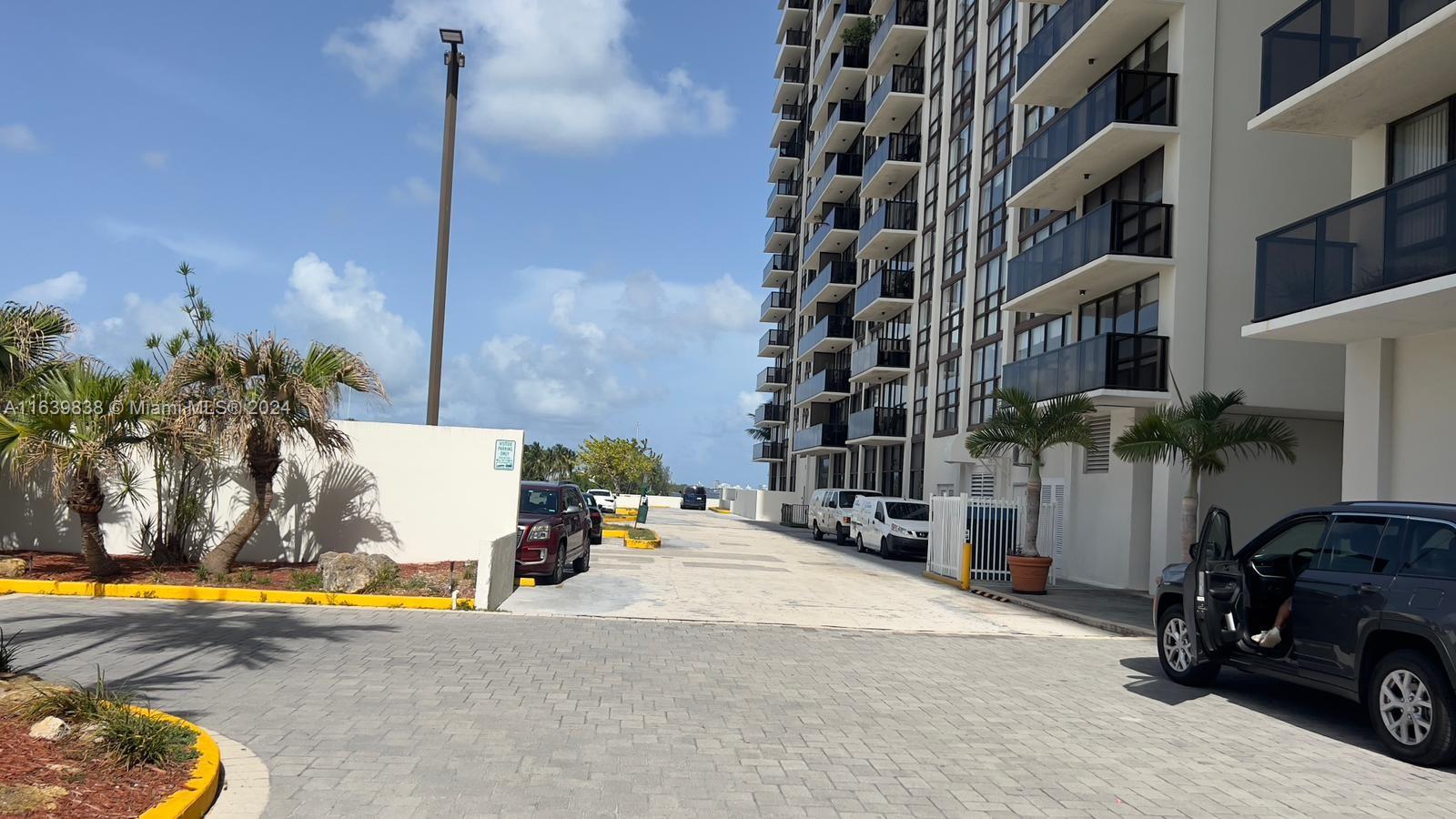 600 Northeast 36th Street, Unit 204 Miami, FL 33137 - Photo 2 of 31 a car parked in front of a building