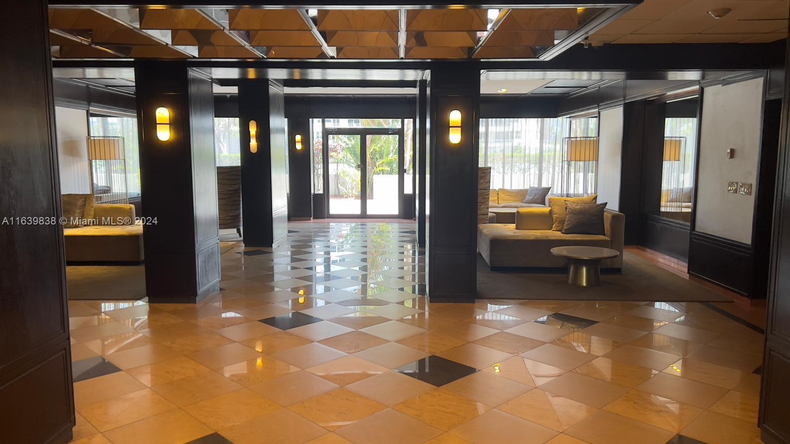 600 Northeast 36th Street, Unit 204 Miami, FL 33137 - Photo 5 of 31 a lobby with furniture and floor to ceiling window