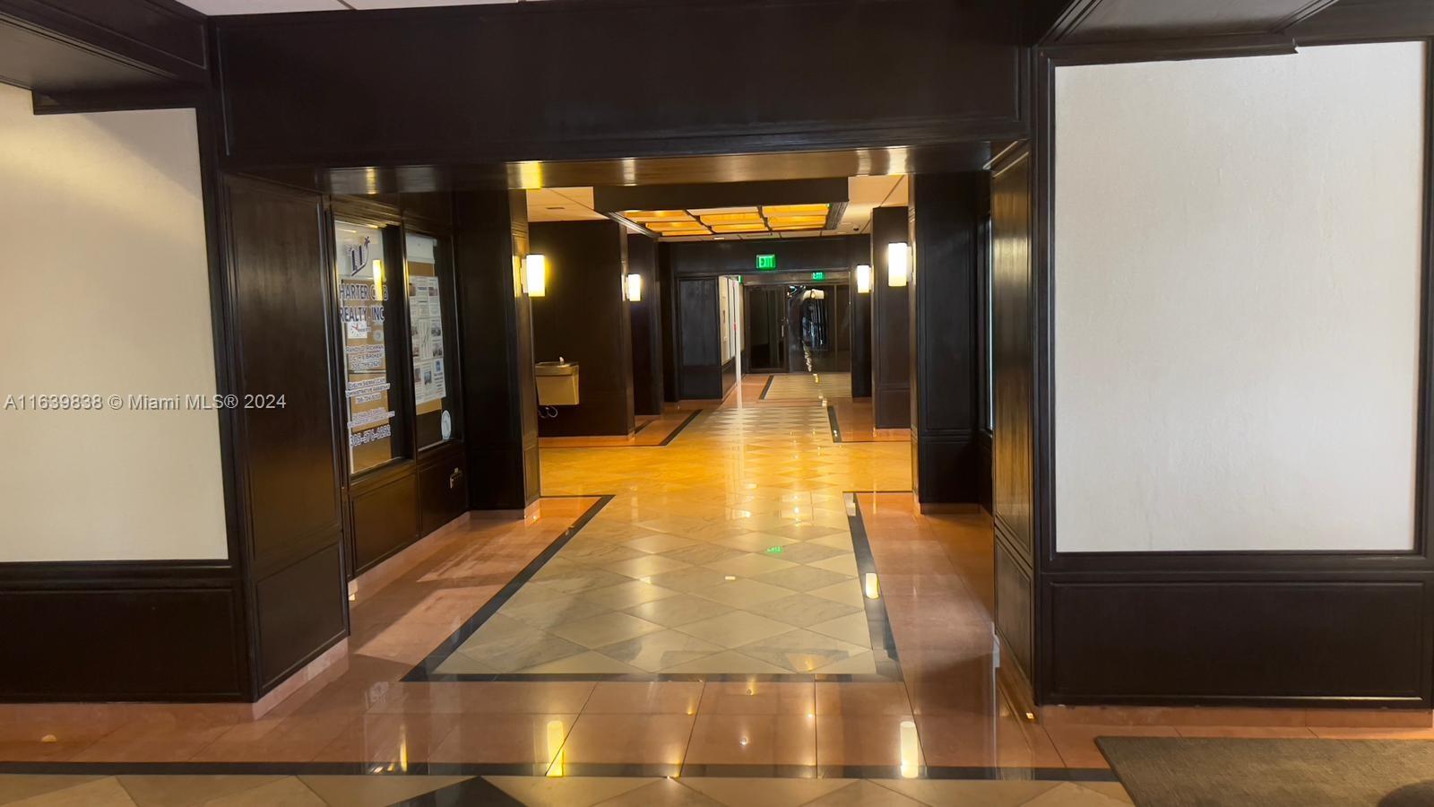 600 Northeast 36th Street, Unit 204 Miami, FL 33137 - Photo 8 of 31 a lobby with glass door and outdoor space