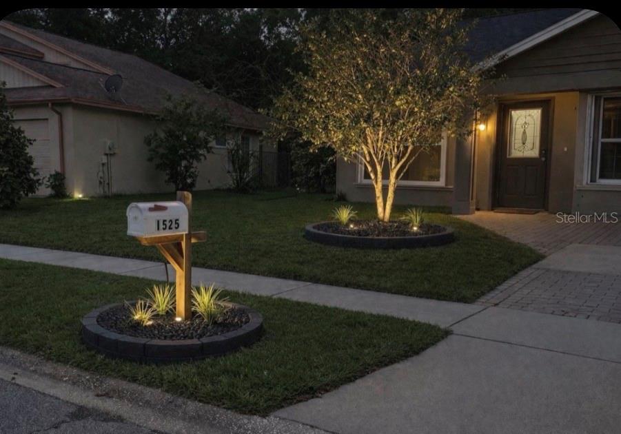 1525 Kestrel Way Brandon, FL 33511 - Photo 3 of 48 a front view of a house with a yard