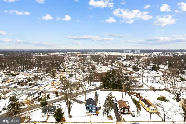 an aerial view of residential building with yard