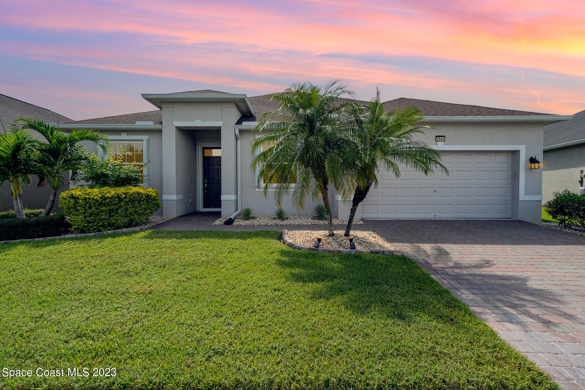 3545 Sansome Circle Melbourne, FL 32940 - Photo 1 of 27 a view of a house with a yard and plants