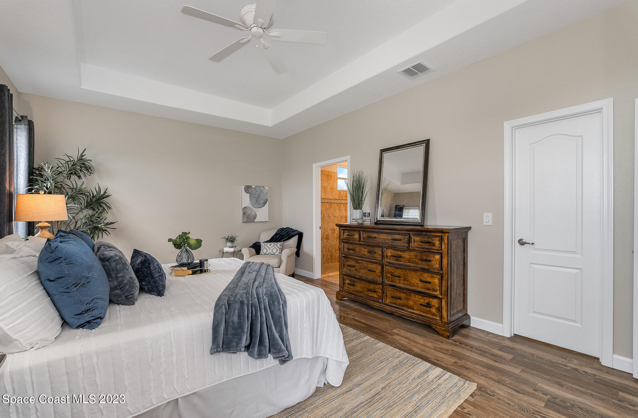 3545 Sansome Circle Melbourne, FL 32940 - Photo 15 of 27 a bed room with a bed and a dresser
