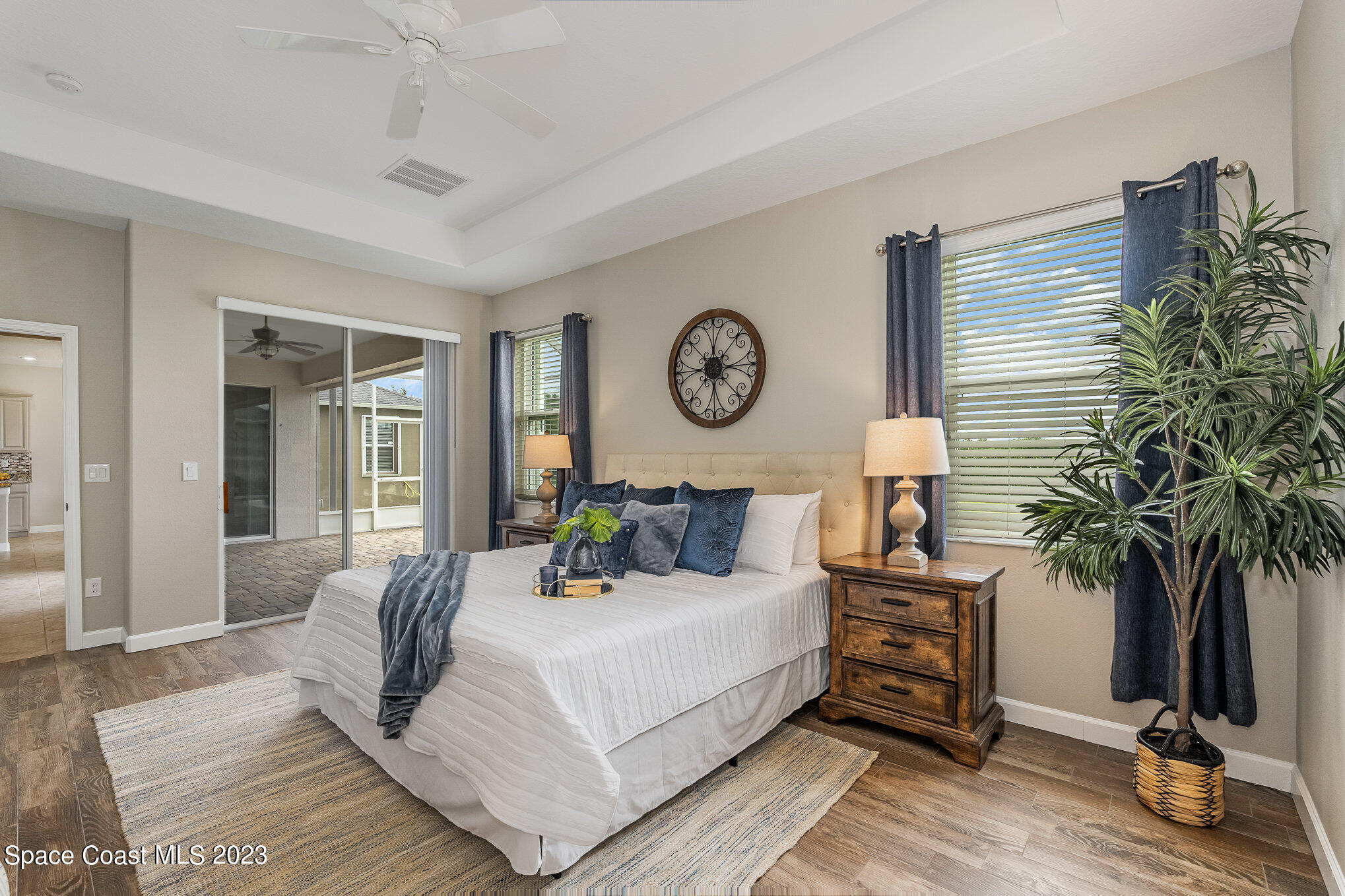 3545 Sansome Circle Melbourne, FL 32940 - Photo 16 of 27 a bedroom with a bed a mirror and paintings on the wall