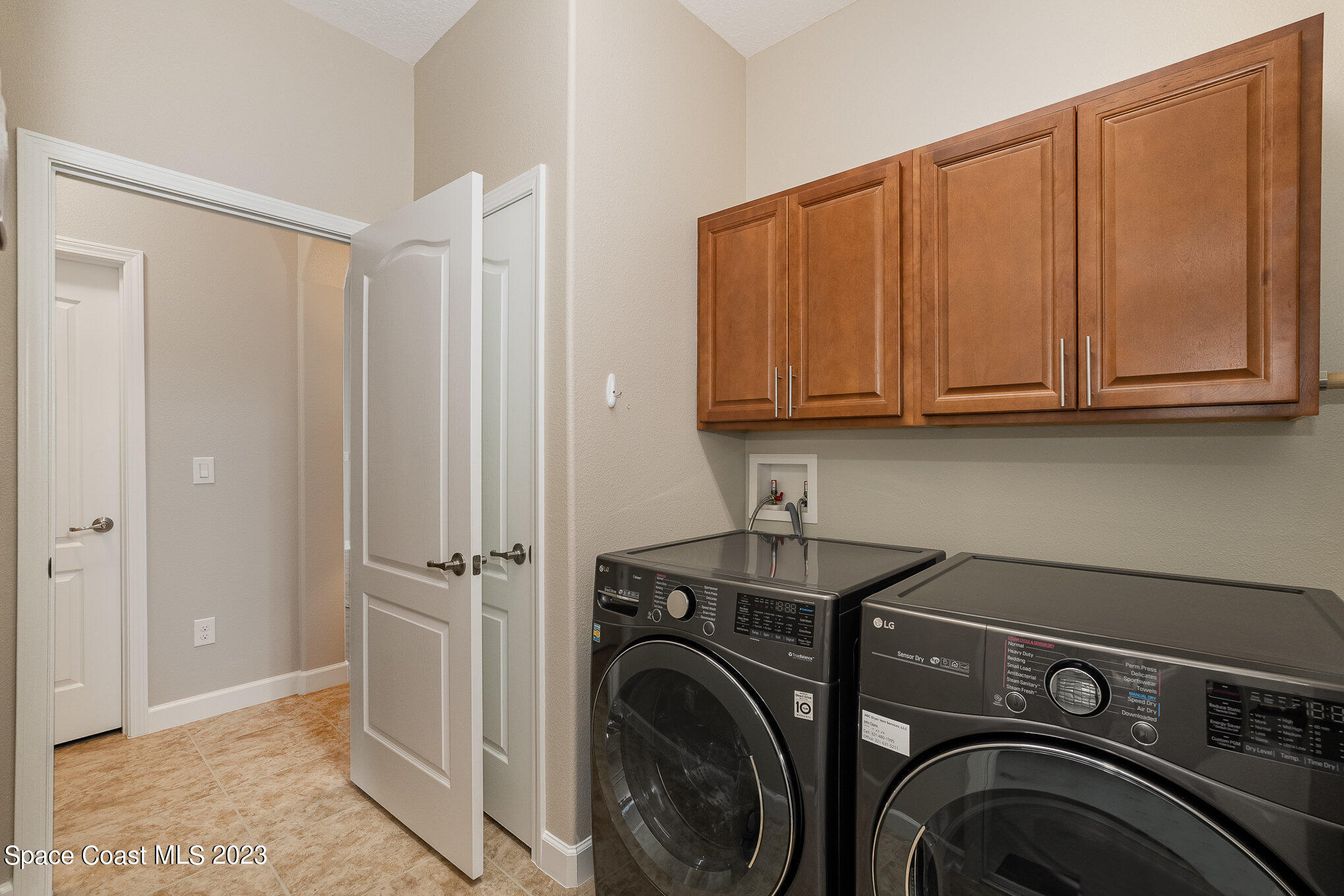 3545 Sansome Circle Melbourne, FL 32940 - Photo 21 of 27 a view of a storage and utility room with washer and dryer