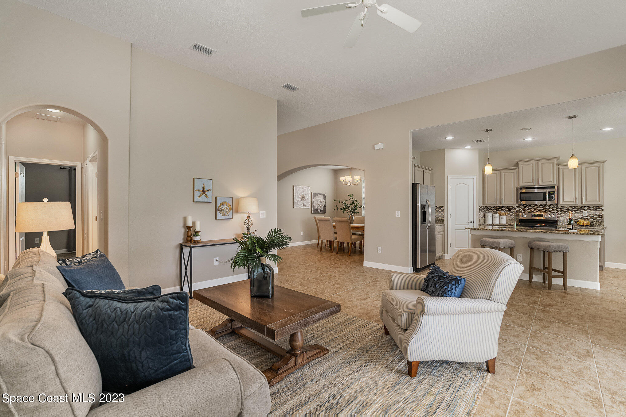 3545 Sansome Circle Melbourne, FL 32940 - Photo 4 of 27 a living room with furniture and kitchen view