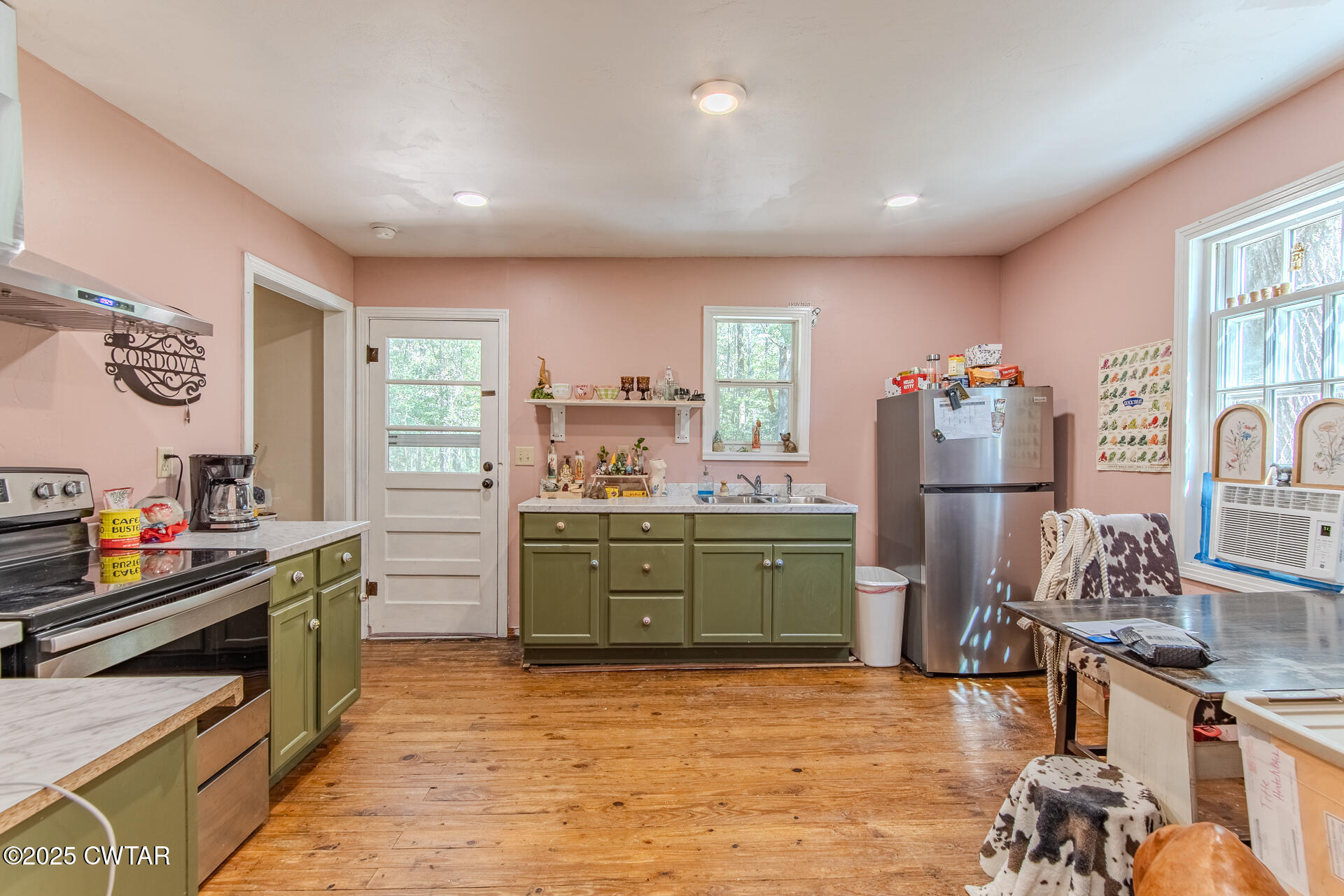 2020 Parkburg Road Medon, TN 38356 - Photo 6 of 24 a kitchen with stainless steel appliances kitchen island granite countertop a stove and a refrigerator