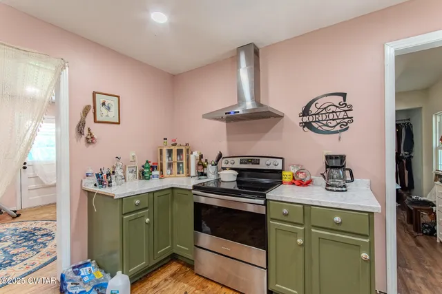 a kitchen with a stove and a sink