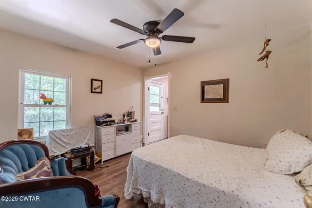 a bedroom with bed and window