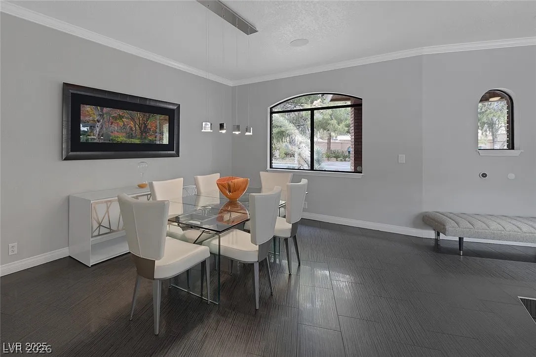 9 Quail Run Road Henderson, NV 89014 - Photo 11 of 57 Clean lines and a spacious layout define this elegant dining area, perfect for entertaining.