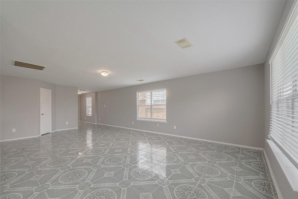 9926 Myrtle Field Lane Houston, TX 77044 - Photo 4 of 33 a view of an empty room and a window