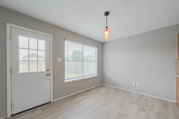 a view of a kitchen with a sink and a window