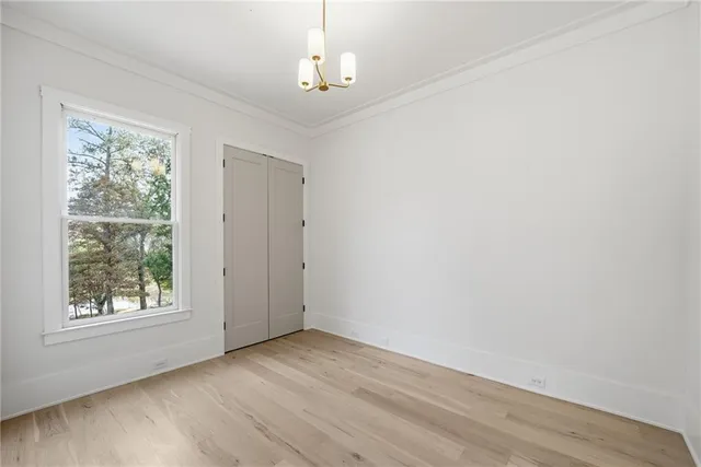 a view of an empty room with glass door