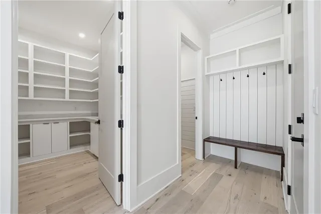 a view of a room with wooden floor
