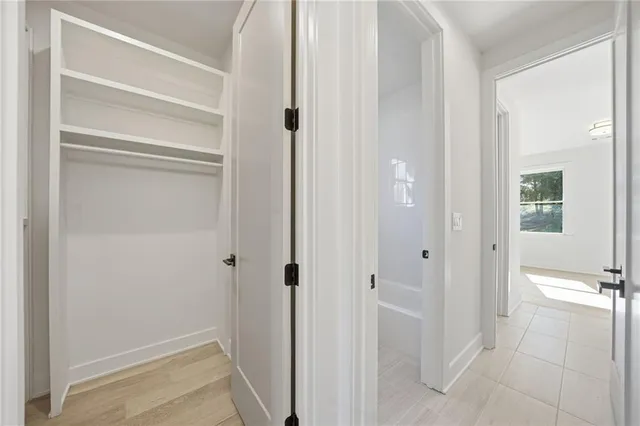 a bathroom with a double vanity sink mirror and