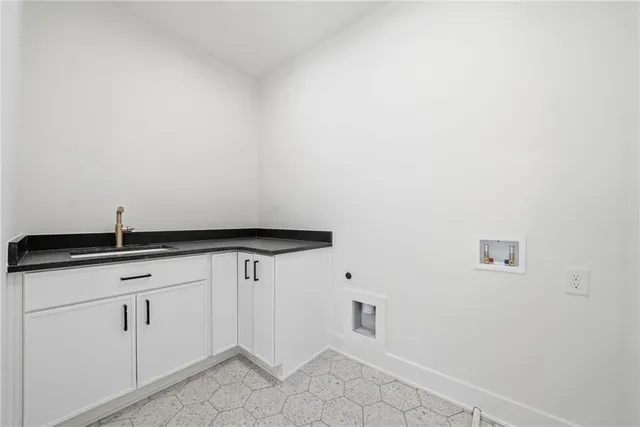 an empty room with a bathroom and a window