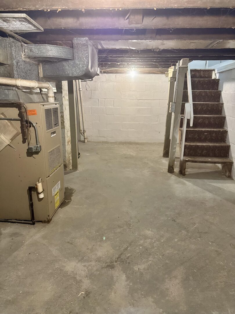 4227 11th Street Rock Island, IL 61201 - Photo 12 of 12 a view of walk in closet with clothes and shoes