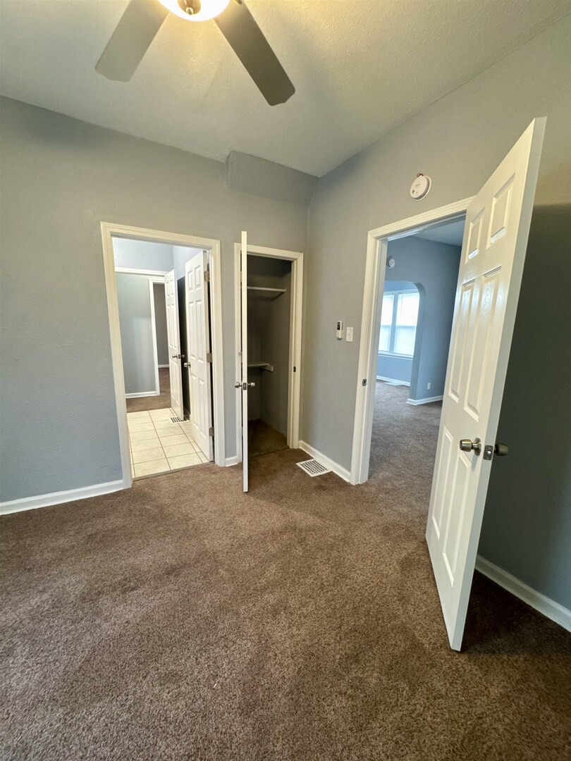 4227 11th Street Rock Island, IL 61201 - Photo 6 of 12 an empty room with windows