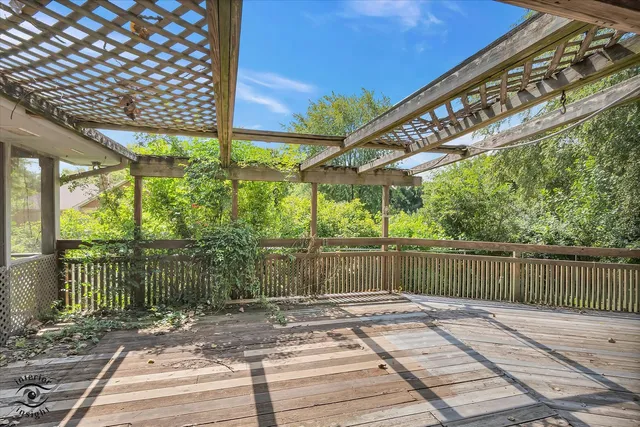 a large kitchen with stainless steel appliances granite countertop a sink and a refrigerator