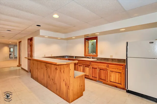 an empty room with window and ceiling fan