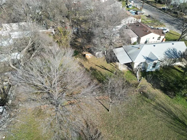 an aerial view of residential house with parking space