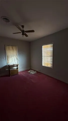 a view of empty room with windows