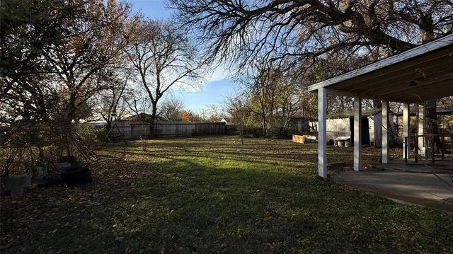 a view of a park with large trees