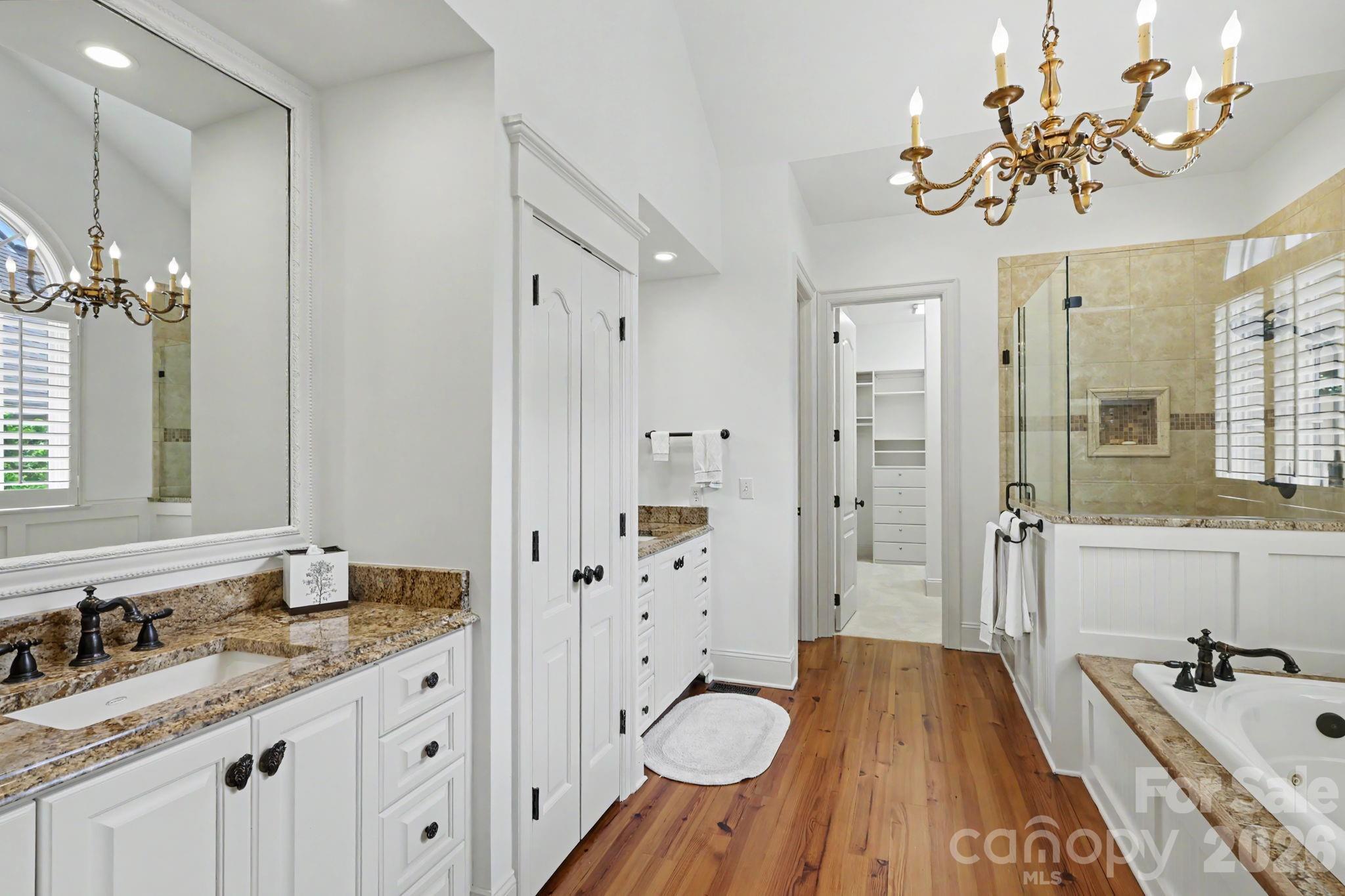 508 Hideaway Ridge Court Matthews, NC 28105 - Photo 11 of 47 a spacious bathroom with a granite countertop sink mirror and shower