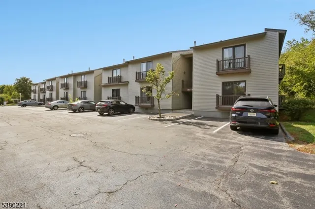 a view of a car park in front of house