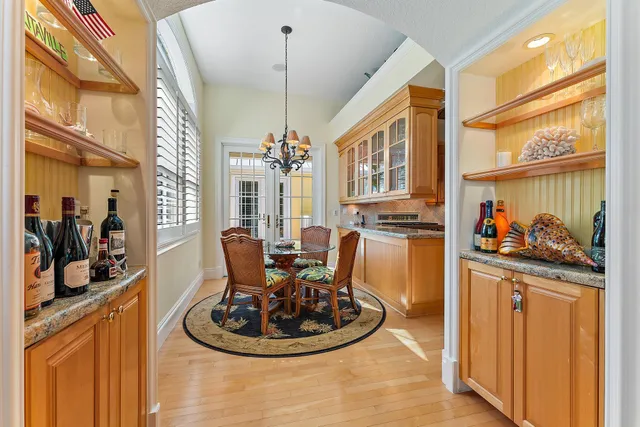 a kitchen with stainless steel appliances granite countertop a sink and a refrigerator