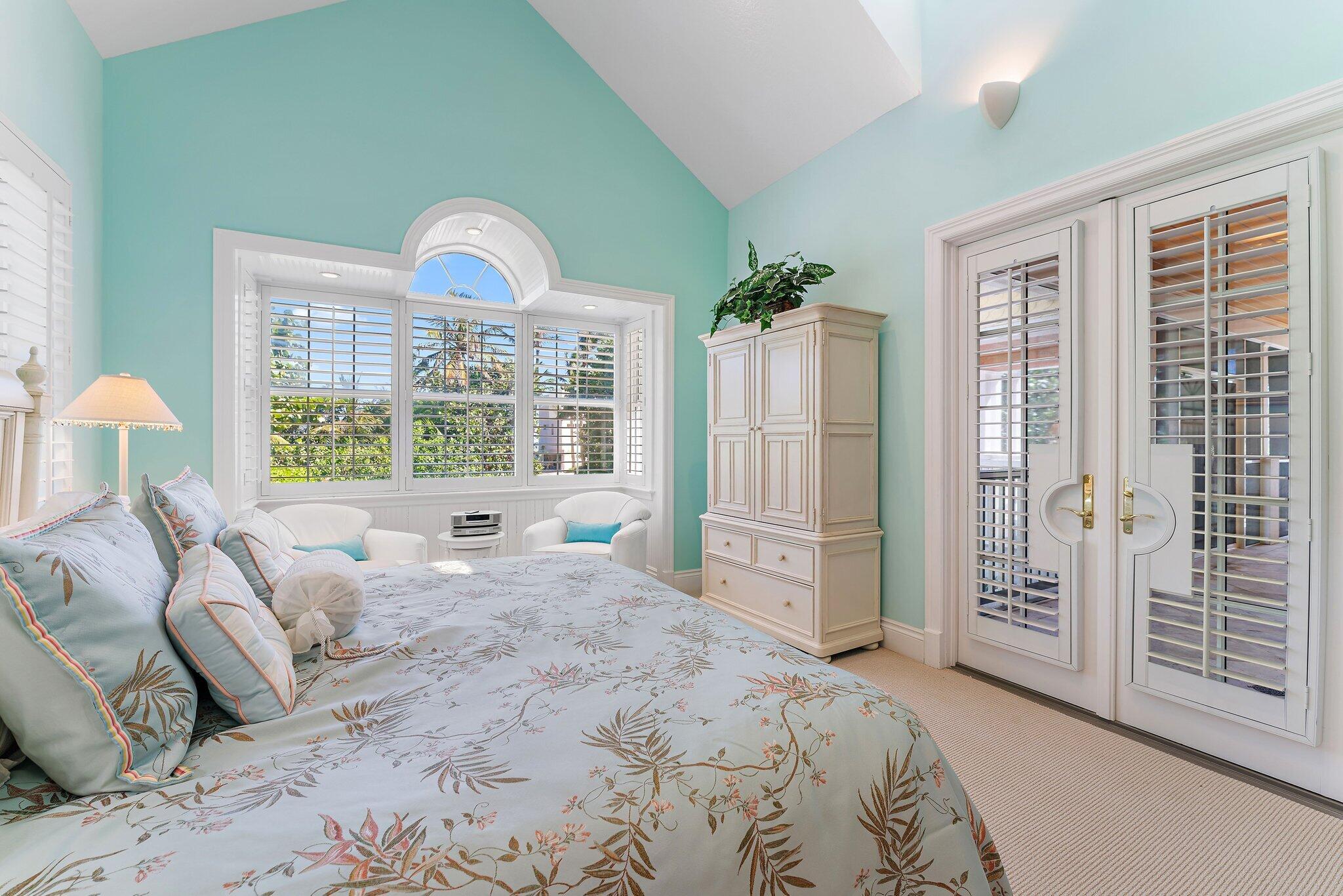 134 North Beach Road Hobe Sound, FL 33455 - Photo 22 of 54 a bedroom with a bed and a large window