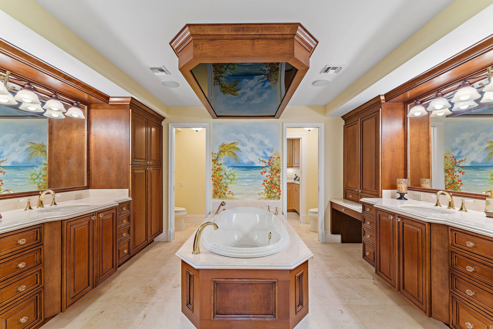 134 North Beach Road Hobe Sound, FL 33455 - Photo 24 of 54 a bathroom with a sink a vanity and a mirror