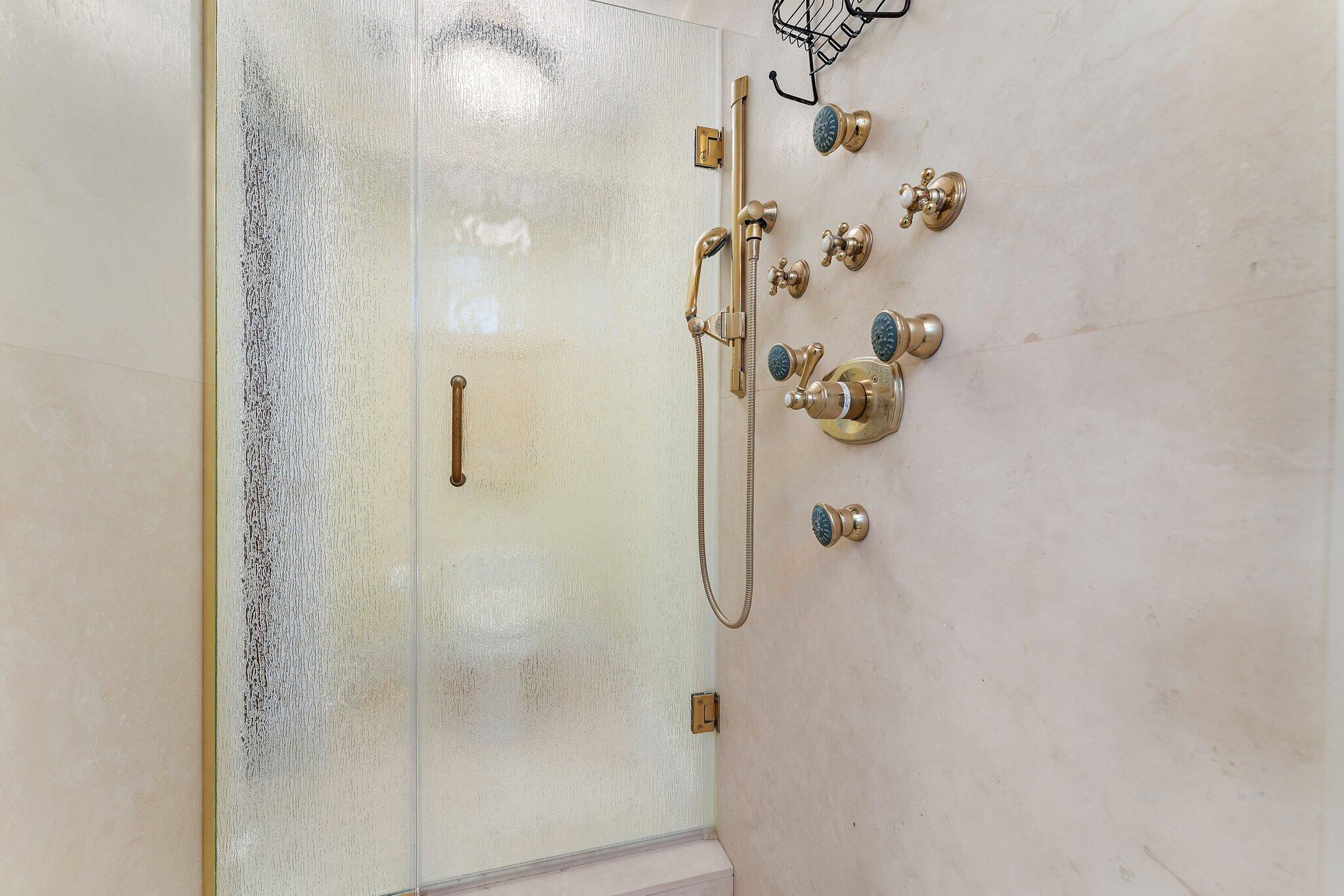 134 North Beach Road Hobe Sound, FL 33455 - Photo 25 of 54 a bathroom with a shower