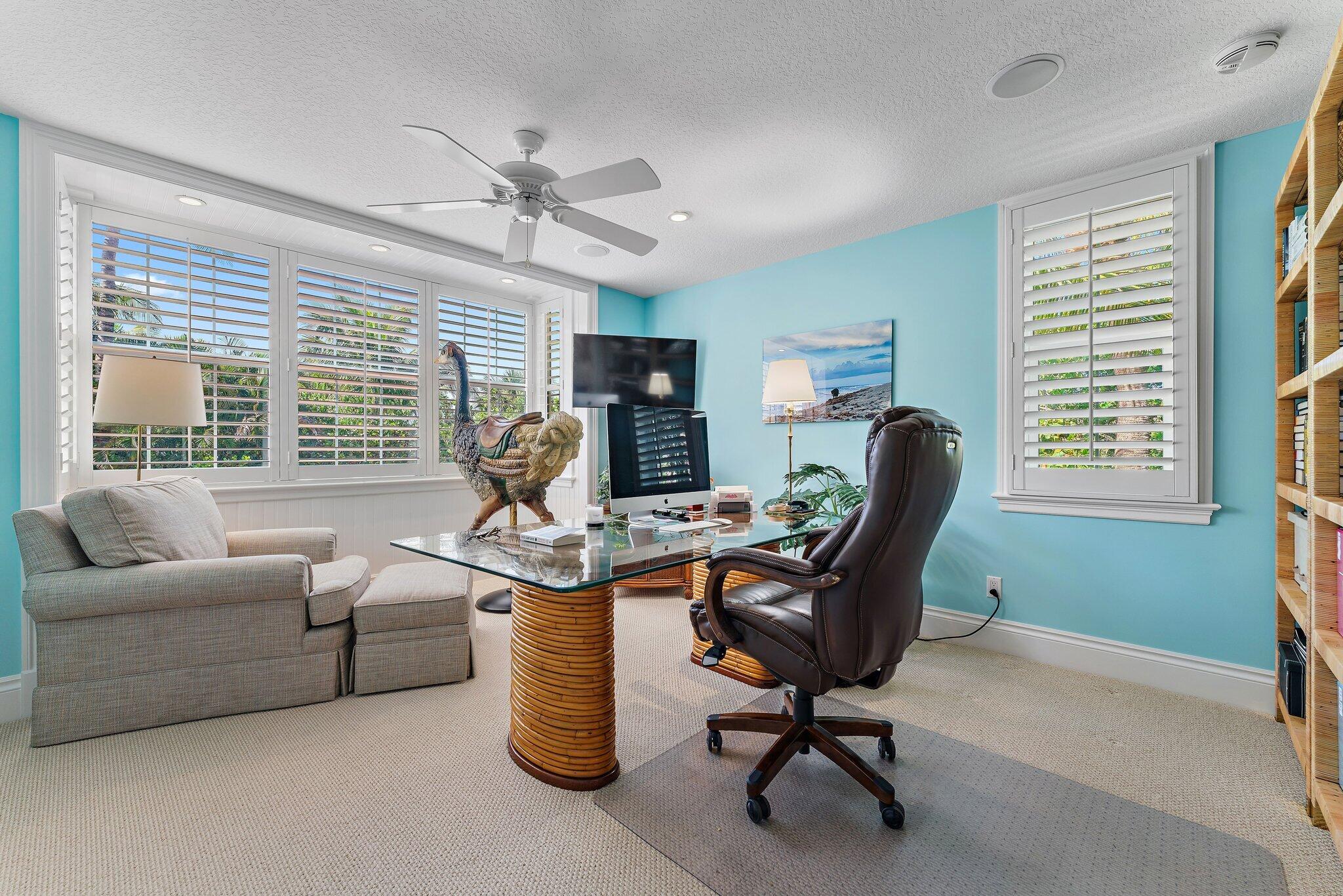 134 North Beach Road Hobe Sound, FL 33455 - Photo 26 of 54 a view of a livingroom with workspace and a window