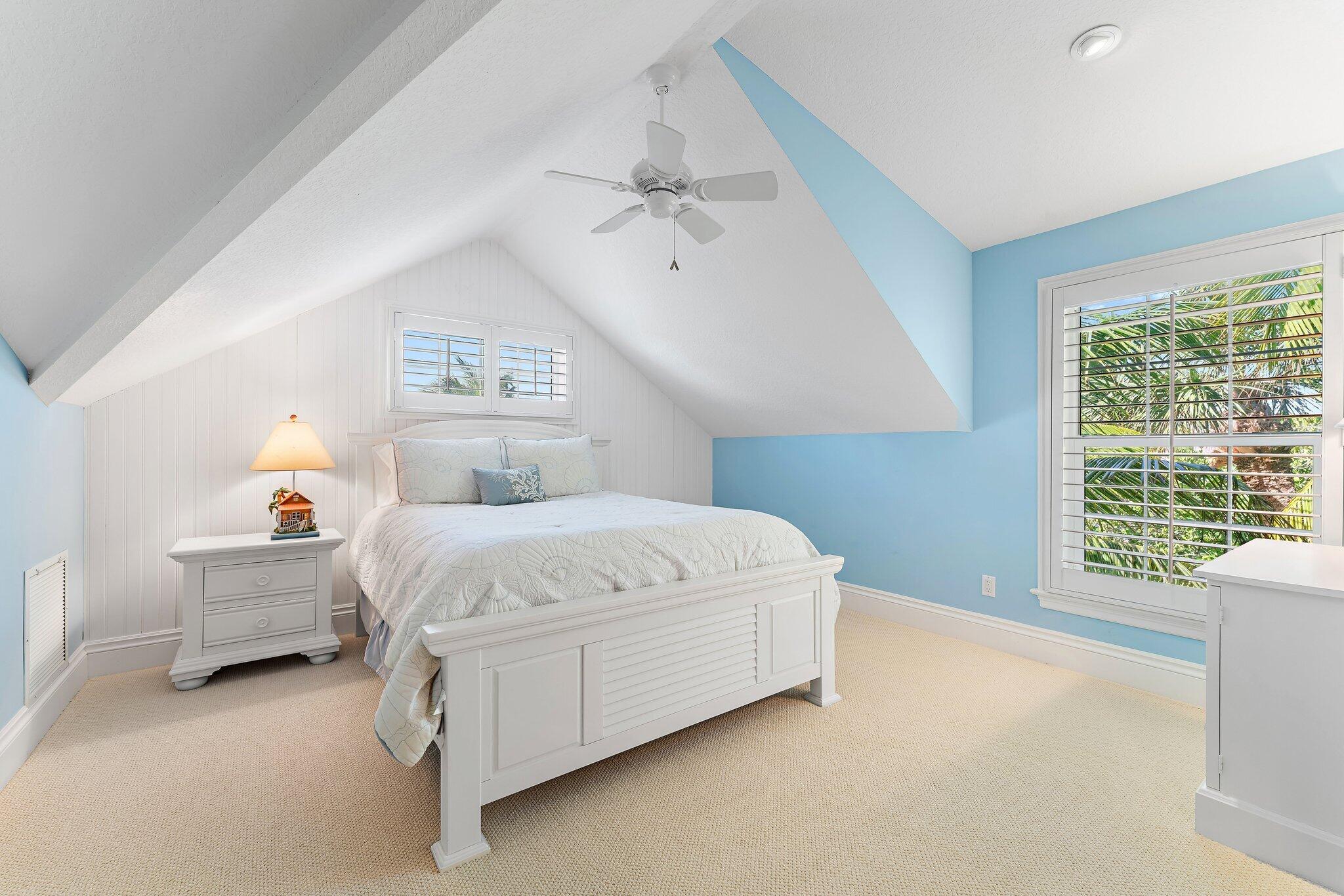 134 North Beach Road Hobe Sound, FL 33455 - Photo 31 of 54 a bed sitting in a spacious bedroom next to a window