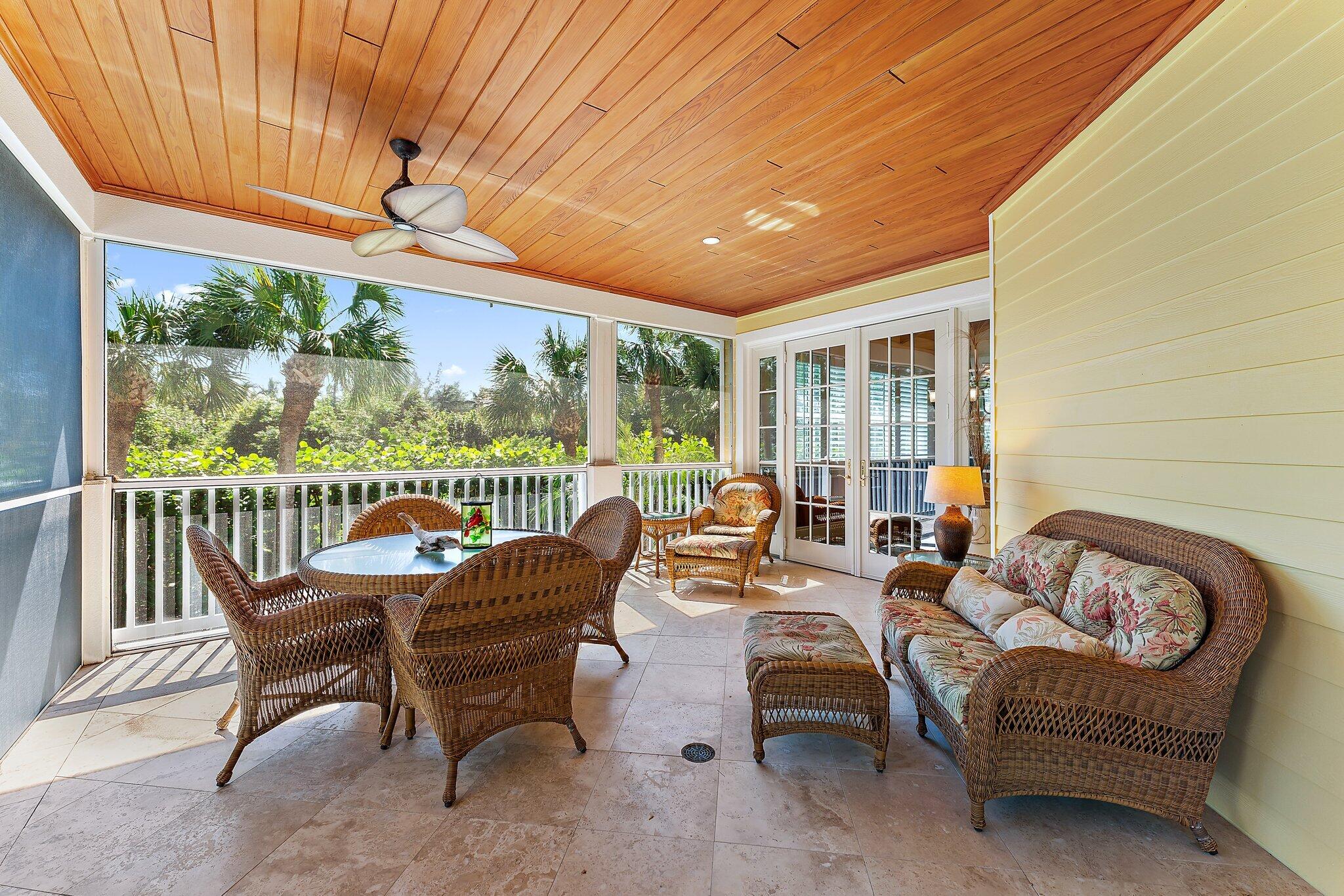 134 North Beach Road Hobe Sound, FL 33455 - Photo 38 of 54 a outdoor living space with furniture and garden view