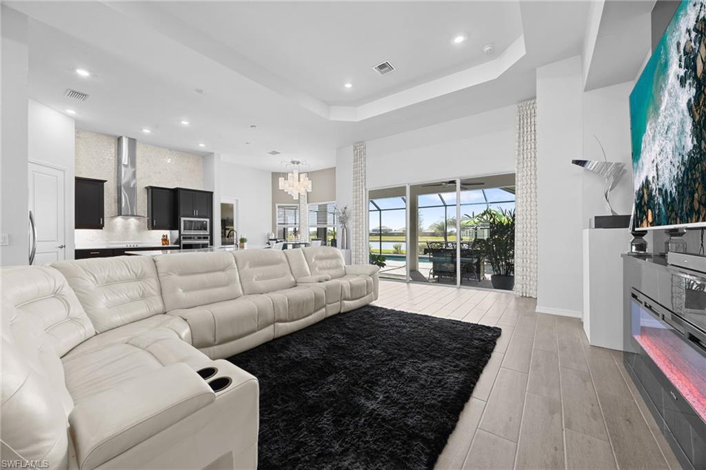 5415 Ternberry Road Ave Maria, FL 34142 - Photo 11 of 45 a living room with furniture and a fireplace