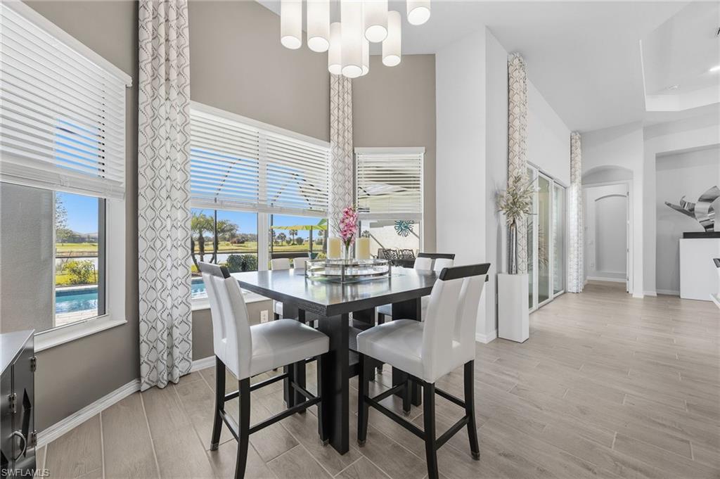 5415 Ternberry Road Ave Maria, FL 34142 - Photo 17 of 45 a view of a dining room with furniture and window