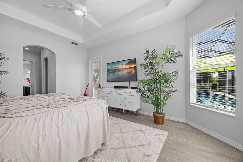 5415 Ternberry Road Ave Maria, FL 34142 - Photo 19 of 45 a bedroom with a bed and a flat screen tv