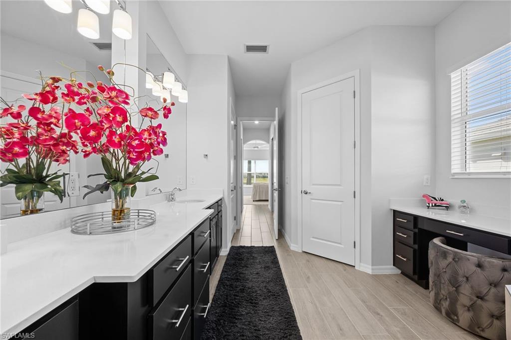 5415 Ternberry Road Ave Maria, FL 34142 - Photo 20 of 45 a kitchen with a sink and cabinets