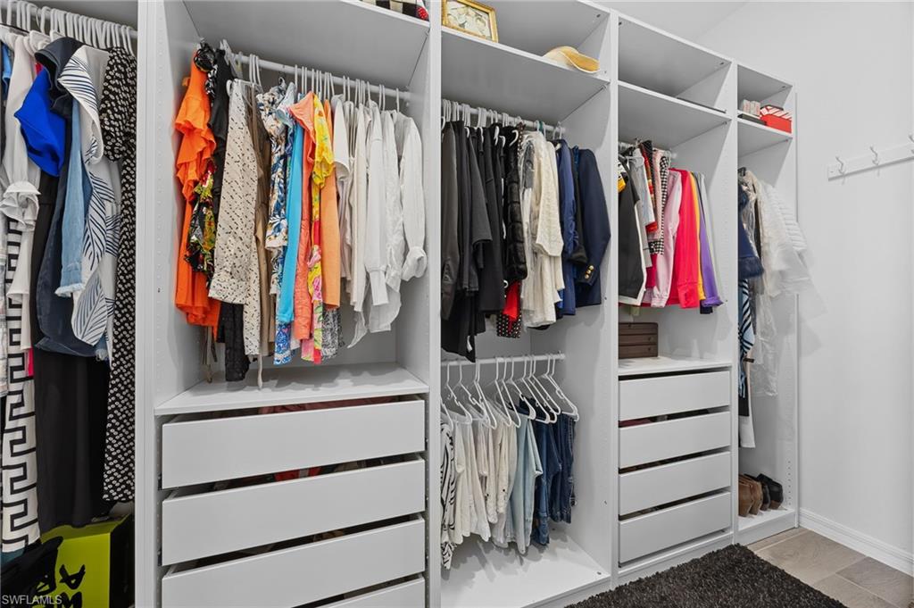 5415 Ternberry Road Ave Maria, FL 34142 - Photo 25 of 45 a view of walk in closet with clothes and shoes