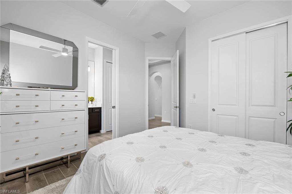 5415 Ternberry Road Ave Maria, FL 34142 - Photo 28 of 45 a bedroom with a bed and a flat tv screen in it