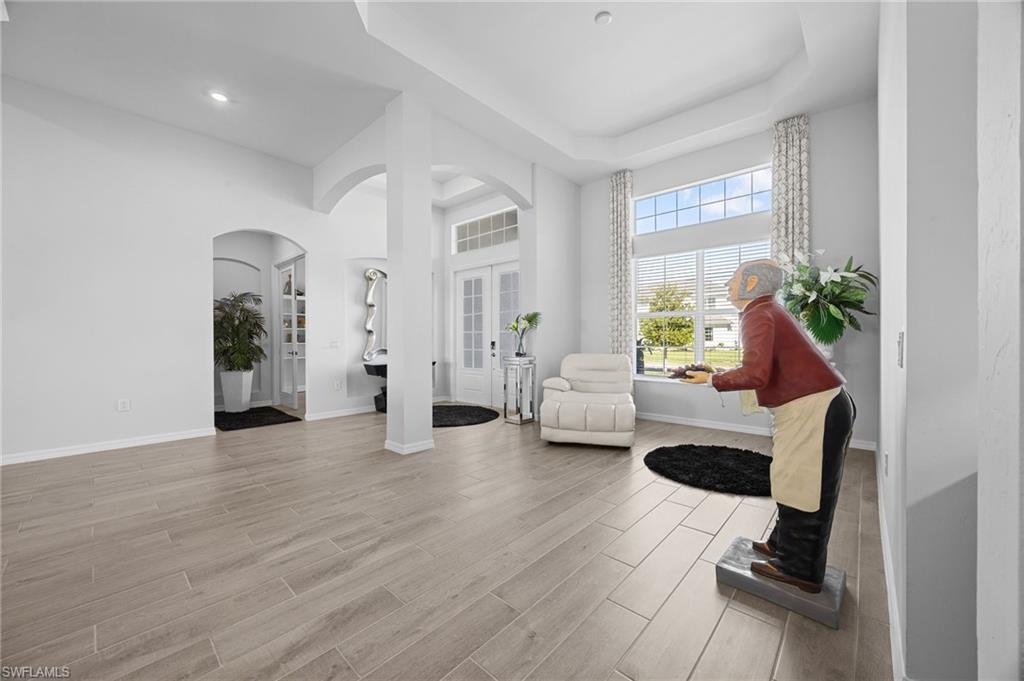 5415 Ternberry Road Ave Maria, FL 34142 - Photo 7 of 45 a living room with furniture and wooden floor
