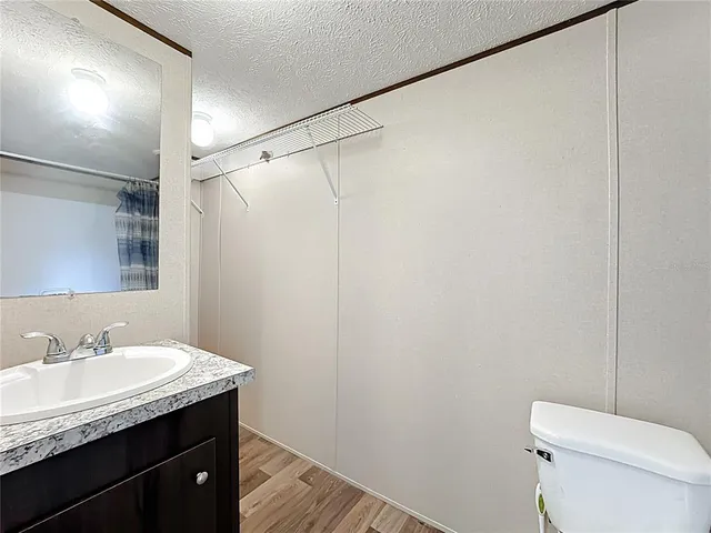 a bathroom with a toilet and shower