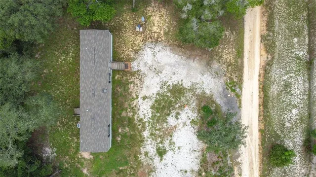 a view of a lake with a house in the background