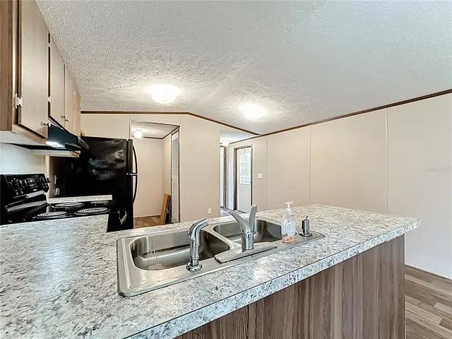 a bathroom with double vanity and a granite counter tops